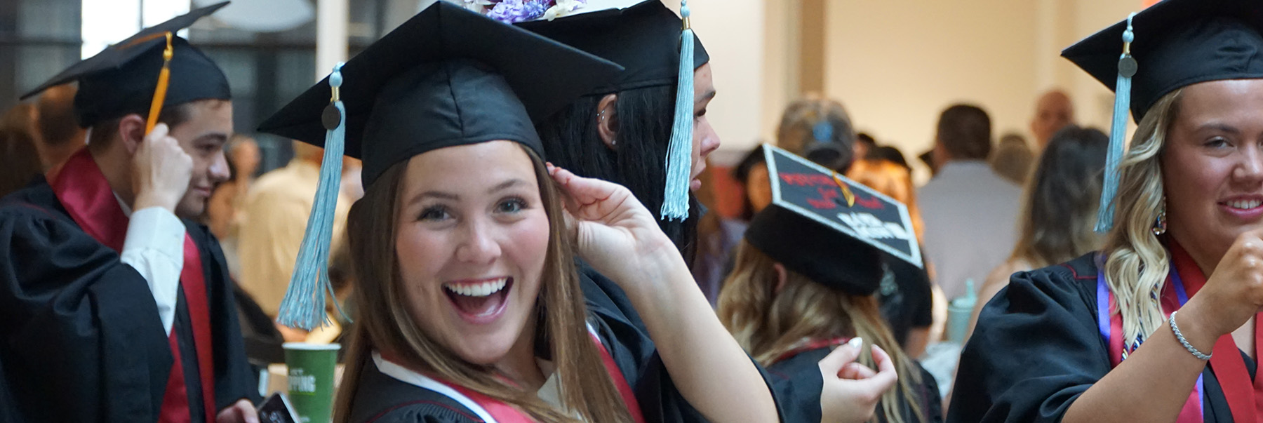Girl posing in commencement regalia