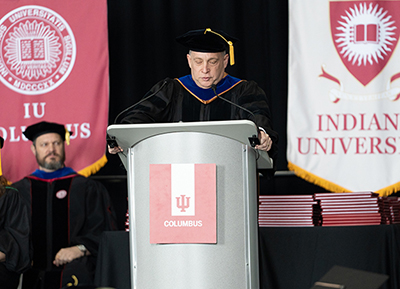 Dr. Reinhold Hill giving the commencement address in 2025.